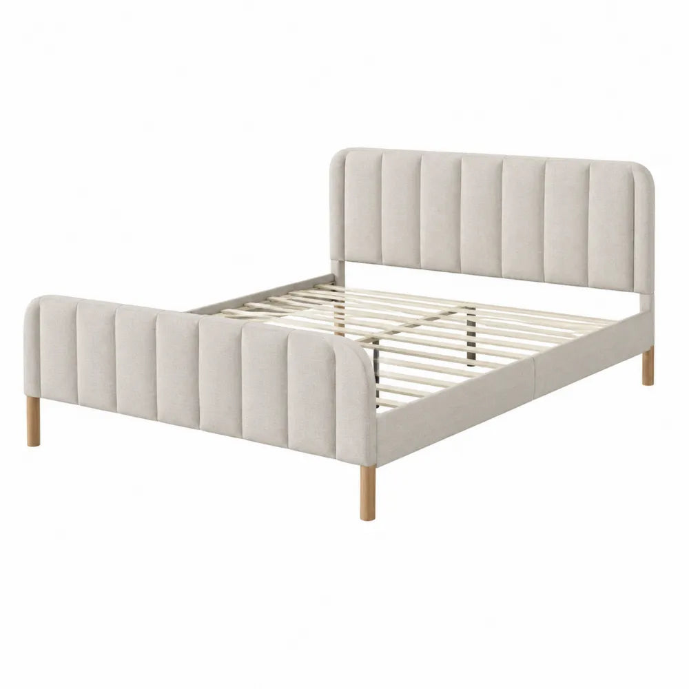 Cama matrimonial tapizada en beige con patas de madera